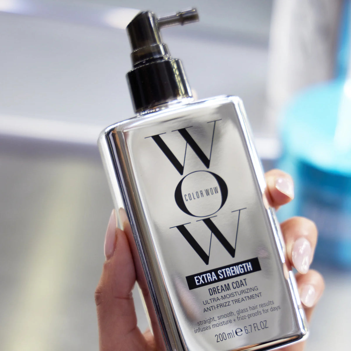 Color WOW Extra Strength Dream Coat 200ml bottle showing sleek packaging and product label for frizz control and shine.